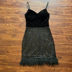 Sexy black velvet cocktail dress with sequined skirt & feather trim